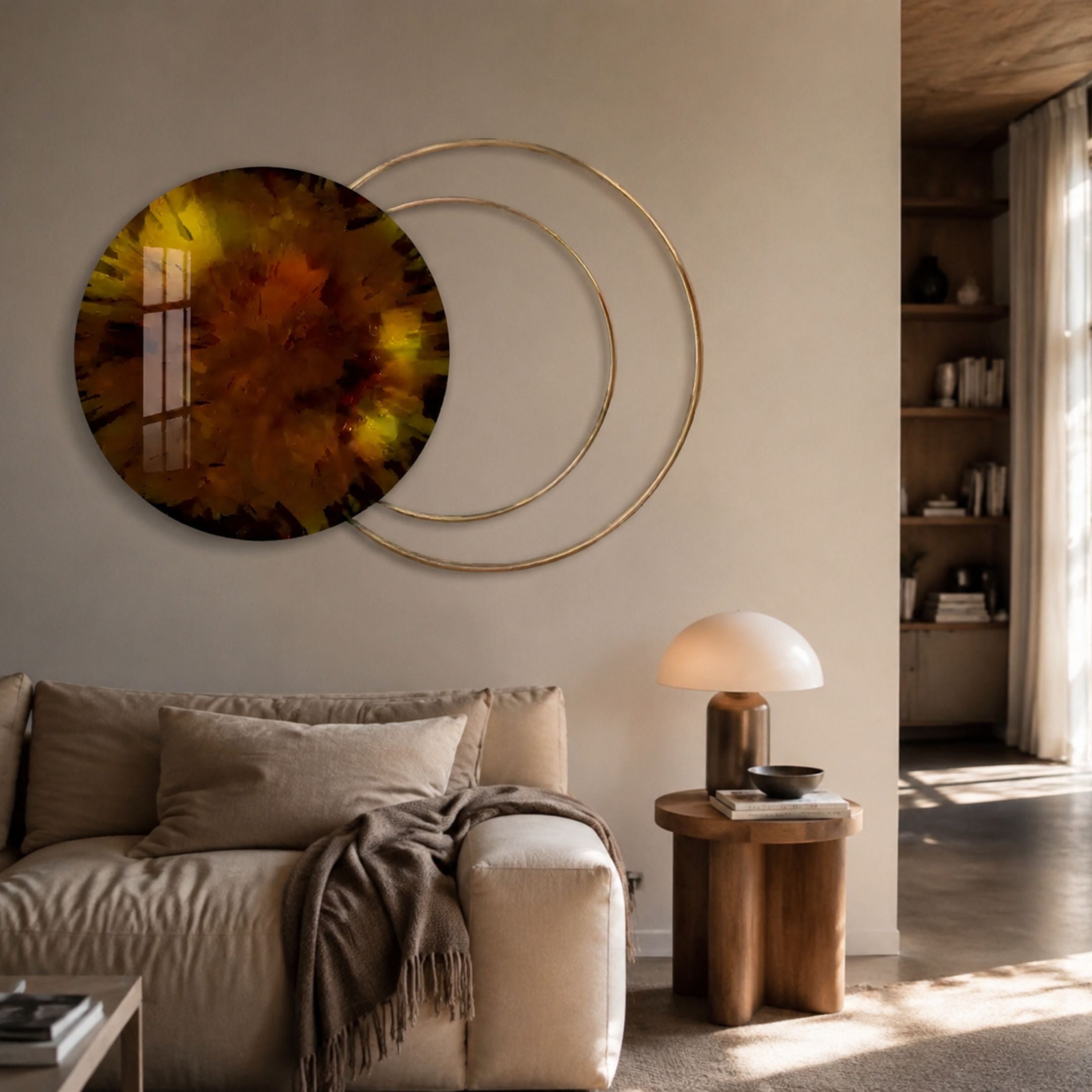 Eclipse Luxe Amber Glow Circular Ring Wall Art by Giant Sculptures displayed above a beige sofa, pairing an amber-toned disc with overlapping gold rings.