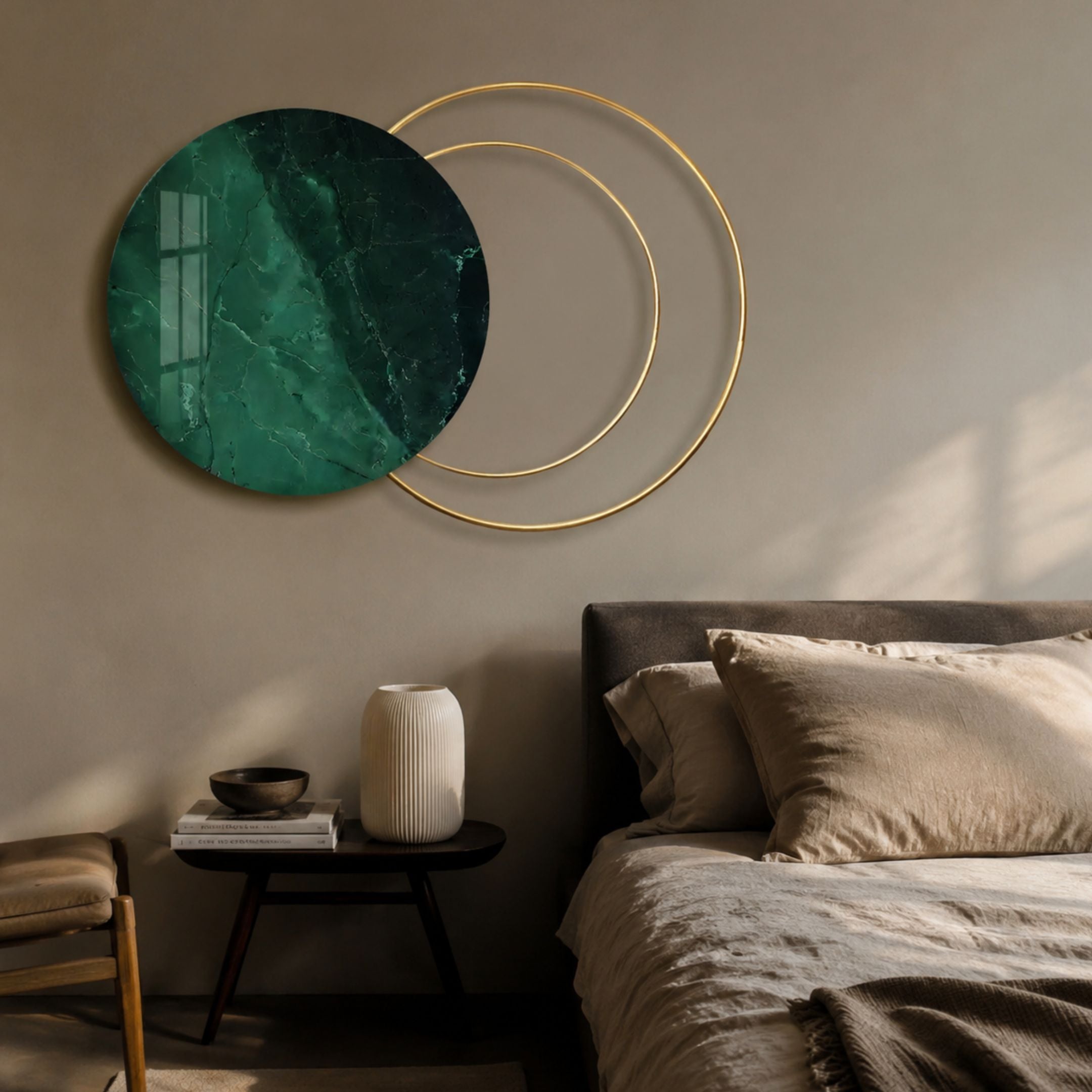 Eclipse Luxe Noir Marble Green Circular Ring Wall Art by Giant Sculptures mounted above a bedside table and upholstered bed in a neutral bedroom.