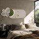 Flutter Bloom Green Butterfly Floral 3D Wall Art by Giant Sculptures mounted above a linen-dressed bed, with sculpted white blooms and gold butterflies on a green oval.