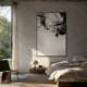Terranica Monochrome Flow Textured Abstract Metal Wall Art by Giant Sculptures hung above a wooden nightstand in a concrete-walled bedroom with linen bedding.