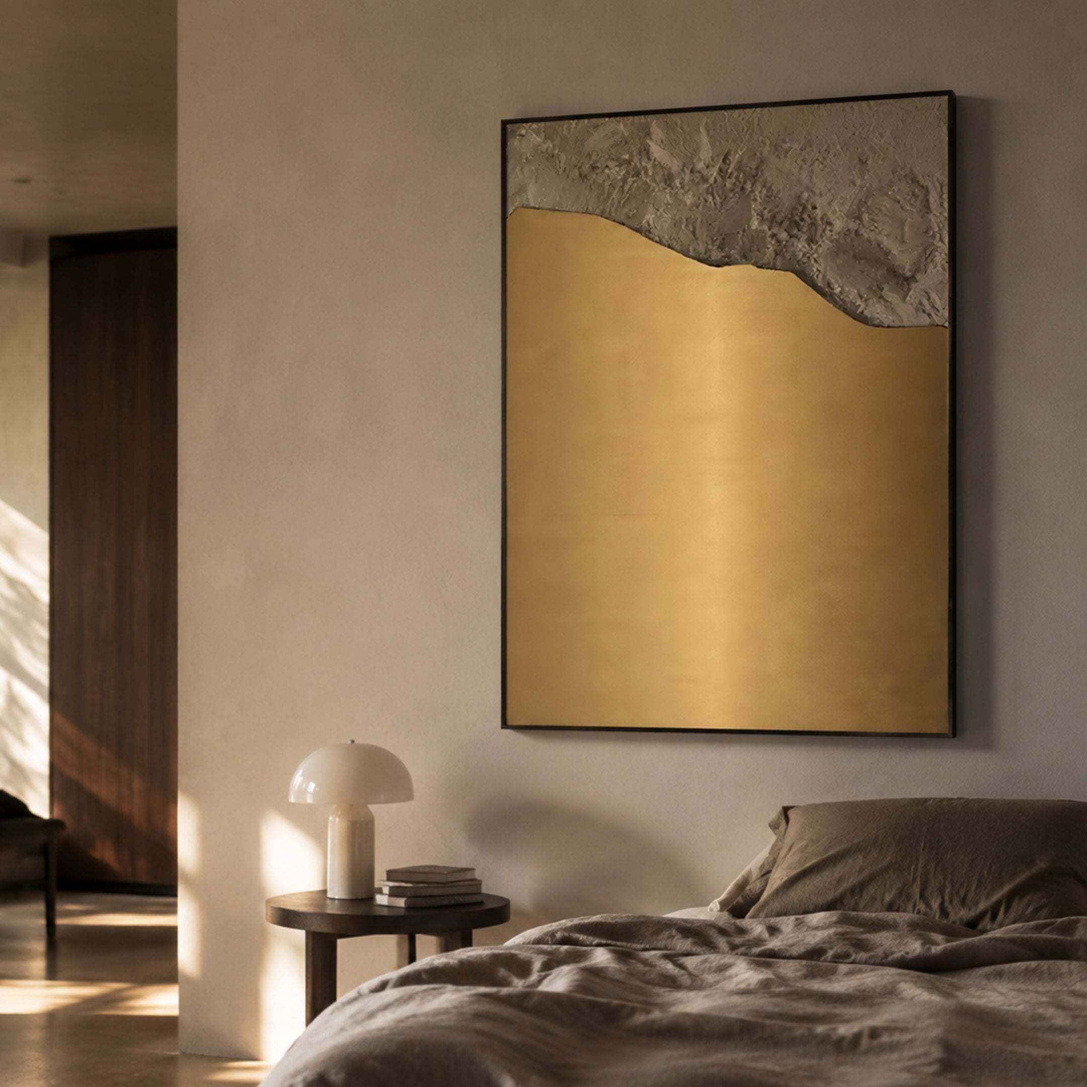 Terranica Metallic Horizon Sandscape Textured Metal Wall Art by Giant Sculptures hung above a bedside table with mushroom lamp in a warm neutral bedroom.