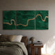 Riverine Flow Emerald Textured Triptych Wall Art by Giant Sculptures, displayed above a leather bed with olive linens and a mushroom lamp on a wooden side table.