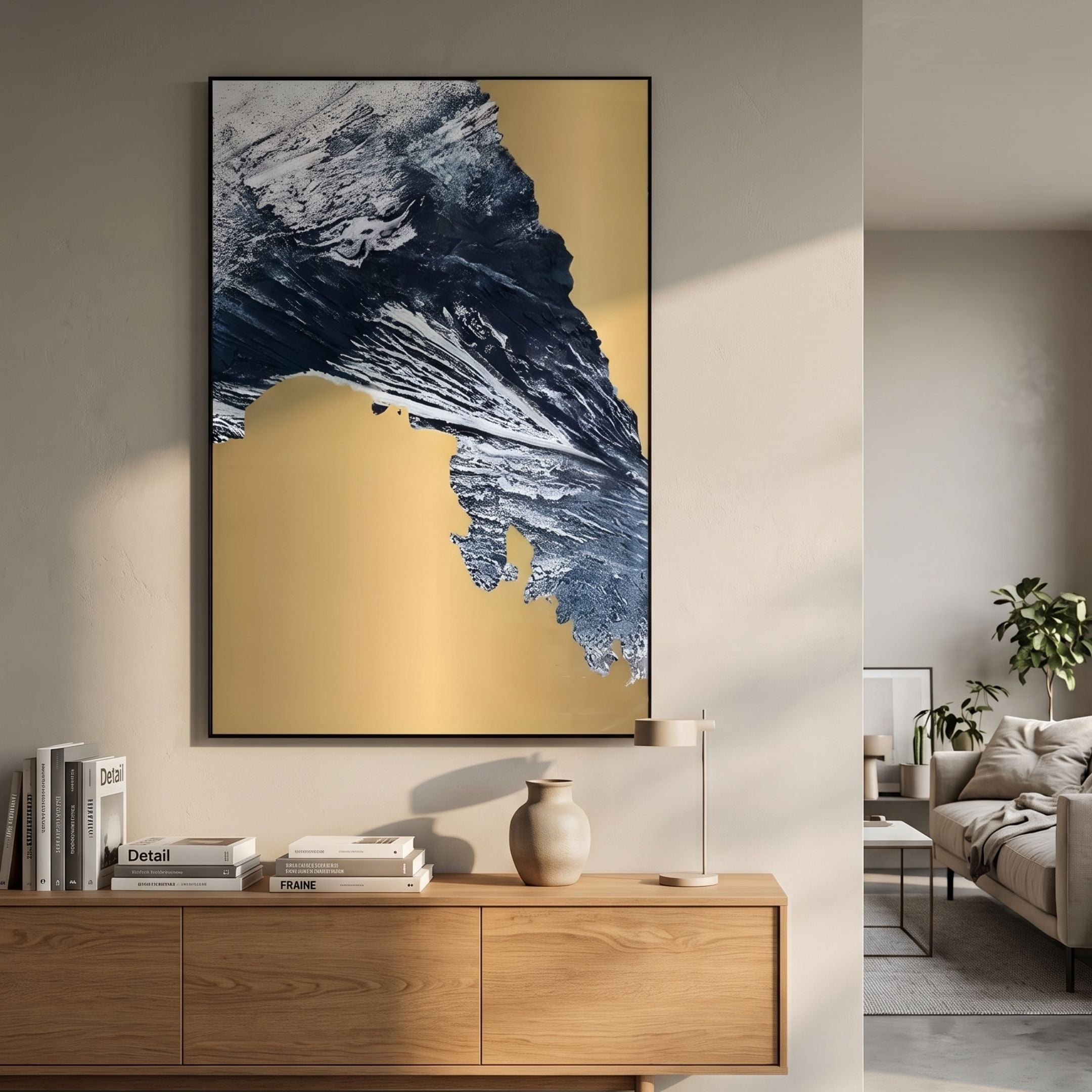 Terranica Golden Terrain Abstract Metal Wall Art by Giant Sculptures displayed above a wooden sideboard with books, vase, and lamp in a neutral living room.