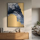 Terranica Golden Terrain Abstract Metal Wall Art by Giant Sculptures displayed above a wooden sideboard with books, vase, and lamp in a neutral living room.