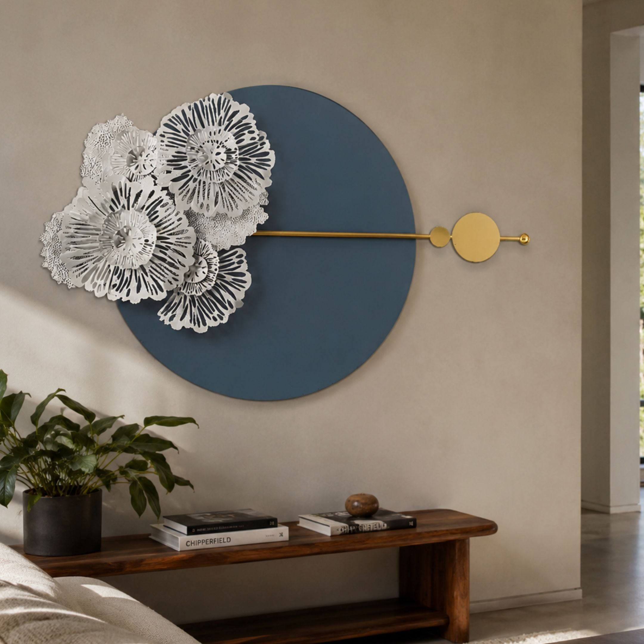 Blossom Halo Ocean Grey Round Floral Decorative Wall Art mounted above a wooden bench with books and a potted plant in a neutral living space.