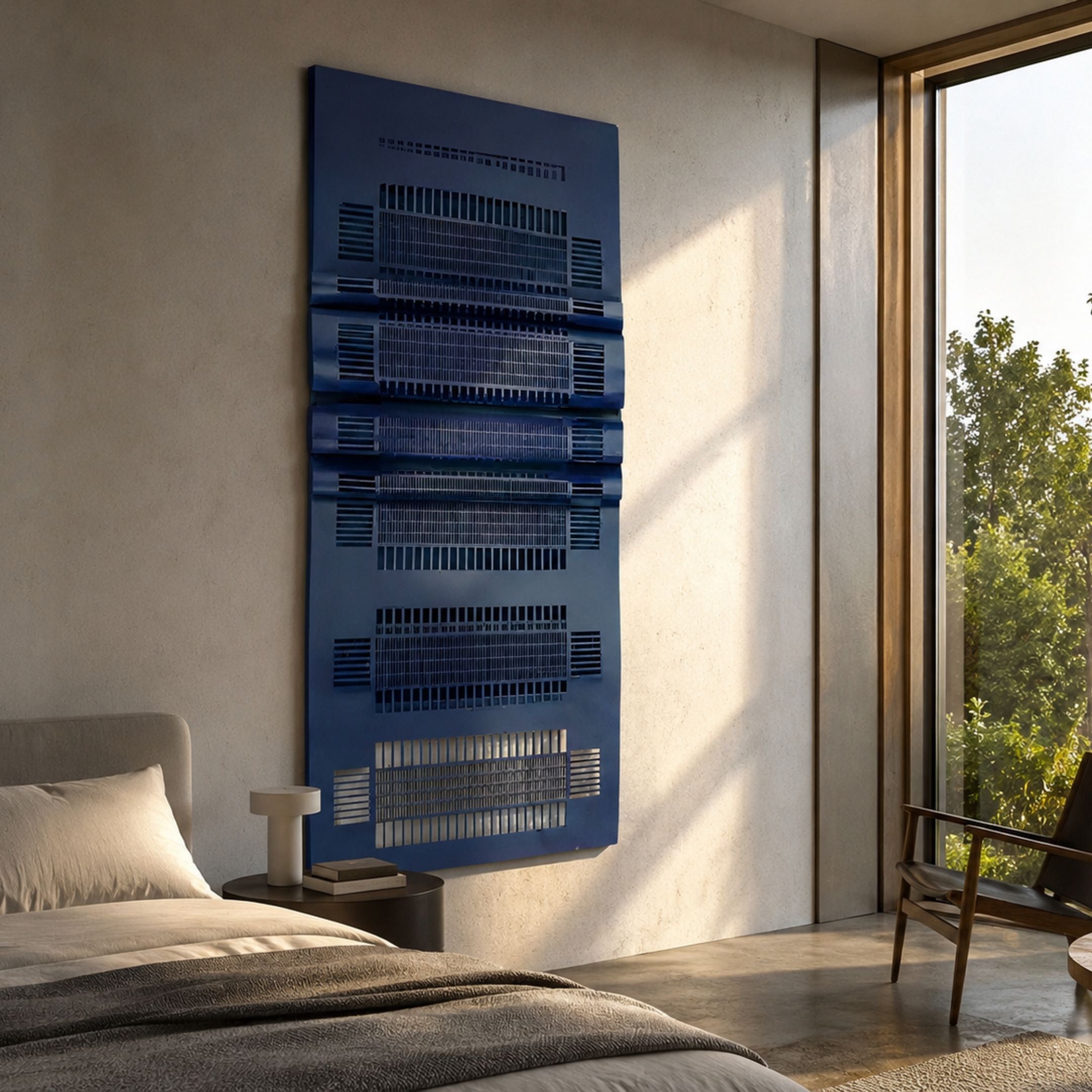 Strata Blue Vertical Folded Grid Metal Wall Art by Giant Sculptures mounted above a bedside table in a sunlit bedroom with bed and chair nearby.