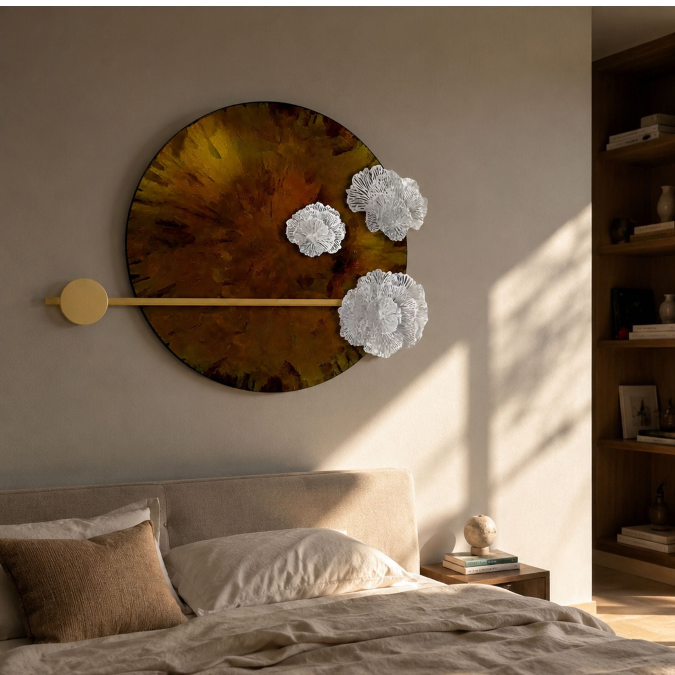 Nova Floral Radiant Amber Circular Wall Art by Giant Sculptures with marbled amber disc, white sculpted florals, and gold bar accent above a bedroom bed.
