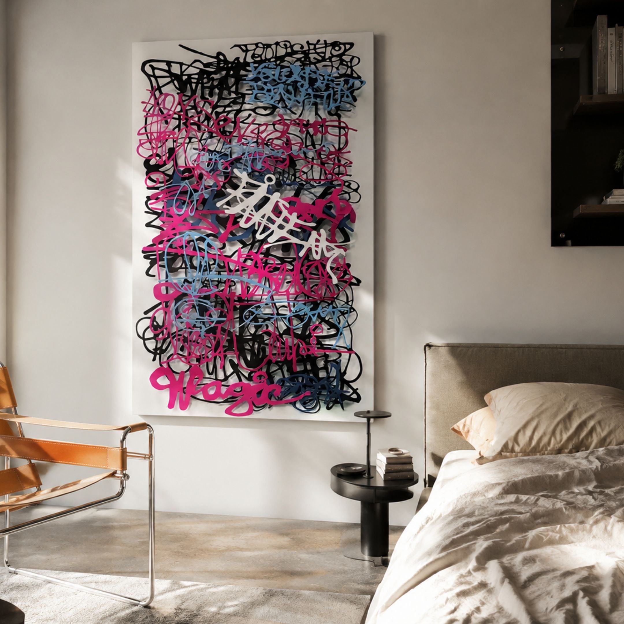Scriptura III Multicolour Graffiti Expression Metal Wall Art by Giant Sculptures mounted in a bedroom above a side table, beside a leather chair and linen bed.