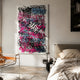 Scriptura III Multicolour Graffiti Expression Metal Wall Art by Giant Sculptures mounted in a bedroom above a side table, beside a leather chair and linen bed.