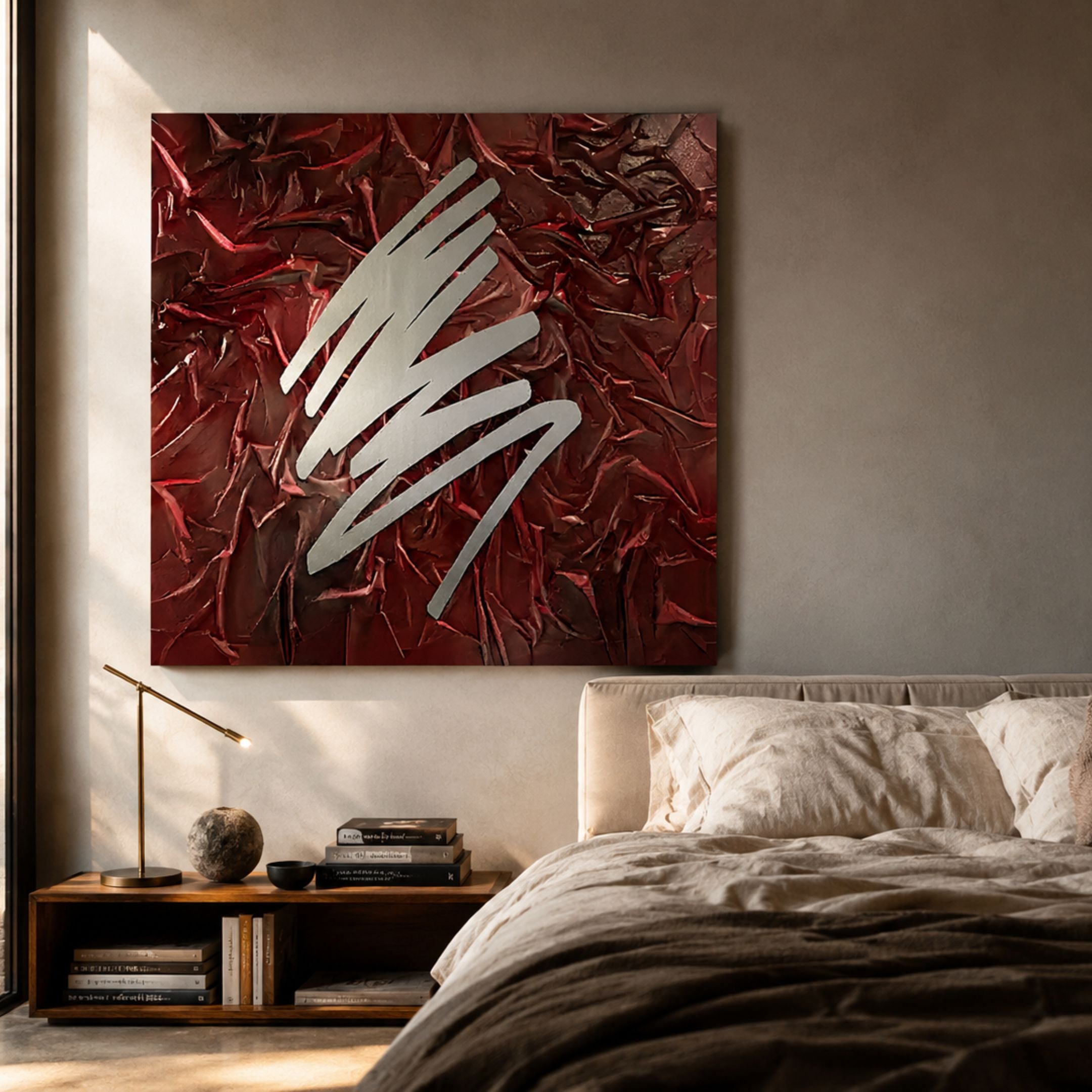 Plisse Crimson Red Textured Abstract Wall Art by Giant Sculptures mounted above a bed, with a silver zigzag over pleated crimson fabric beside a timber nightstand.