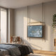 Celestique Golden Pavilion Framed Long Hanging LED Wall Art by Giant Sculptures suspended above a bed, with blue-grey abstract print and warm LED light bar.