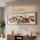 Brassica Gold Leaf Metal Rectangular Wall Art by Giant Sculptures with gold and bronze leaves on a white panel, hung above a walnut console with books and a lamp.