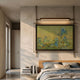 Celestique Misty Horizons Framed LED Wall Art by Giant Sculptures hung above a wooden bed, depicting blue hills under a yellow sky with overhead light bar.