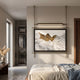 Celestique Ancient Bonsai Framed LED Wall Art by Giant Sculptures hanging on a bedroom wall, illuminated by its integrated brass LED bar above the bed.