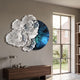 Aurum Flora White Petals Sapphire Metal Wall Art by Giant Sculptures, sculpted white blooms over a sapphire-blue circular panel, above a walnut console.