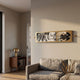 Resonance Record Wall Art by Giant Sculptures mounted above a grey sofa, featuring Beatles Abbey Road and Eminem covers in a gold mixed-media panel.