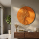 Cellura Orange Geometric Flow Gold Wired Metal Wall Art mounted above a walnut sideboard with books and a vase, beside a fiddle-leaf fig in a modern room.