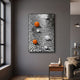 Giant Sculptures Luminosa Orange & White Orb Textured Metal 3D Wall Art with two orange and four white spheres on a rippled silver panel, hung in a grey living room.