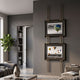 Imperia Vibrant Balloon Journey Dual Frame Metal Wall Art by Giant Sculptures, two black and gold frames suspended on brass rods above a sofa in a grey living room.