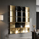 Onda Black & Gold Rippled Geometric Metal 3D Wall Art by Giant Sculptures, tessellated panels mounted on a grey wall beside a floor lamp and console.