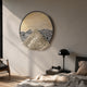 Aurelio Bottom Metallic Layered Textured Round Wall Art by Giant Sculptures, hung above a bedside table with black lamp in a neutral bedroom setting.
