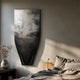 Echo Forest Textured Abstract Panel by Giant Sculptures mounted above a bed, showing a tapered black and silver etched forest scene in a neutral bedroom.