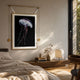 Glacia Jellyfish Crystal Hanging Framed Wall Art by Giant Sculptures suspended from a brass rod above a wooden console in a sunlit bedroom.