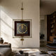 Ethereal Frames Golden Tree Classic Suspended Wall Art by Giant Sculptures, with a dark panel and radiating gold tree motif in a brass rod frame above a living room sofa.
