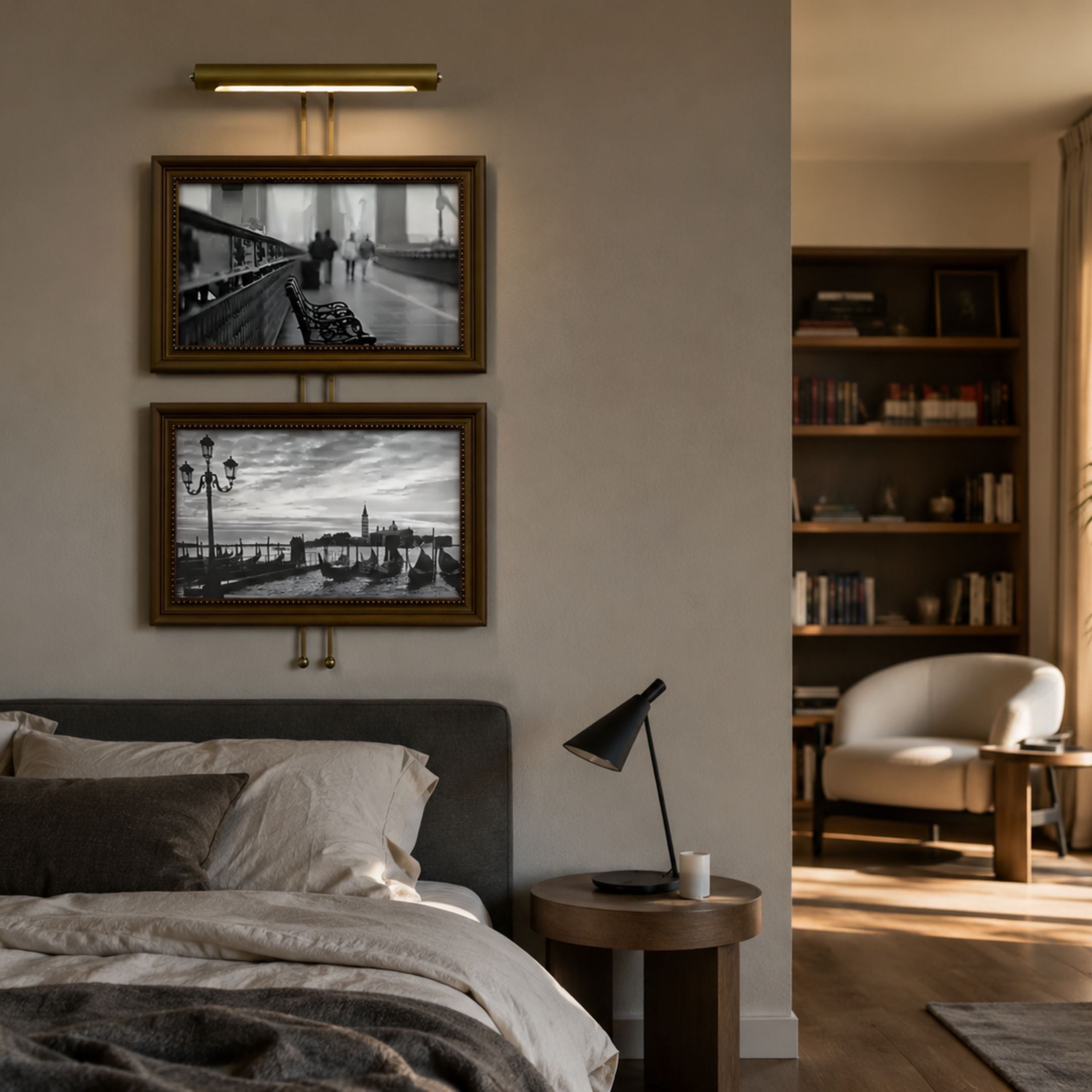 Artisera Venetian Promenade Classic Dual Frame Built-In Light Wall Art displayed above a bed, with bronze frames, black-and-white Venice scenes, and warm picture light.
