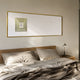 Lustreline Golden Left Plaster Statue Cardboard Wall Art by Giant Sculptures displayed above a wooden bed with linen bedding and a brass lamp.