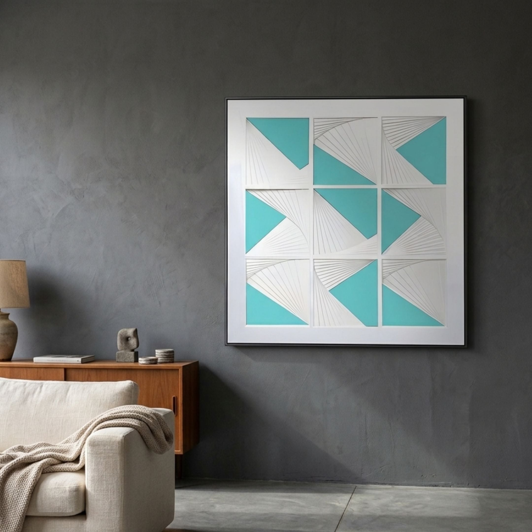 Prismatics Turquoise Geometric Cardboard Wall Art by Giant Sculptures displayed on a dark grey wall above a wooden sideboard in a modern living room.