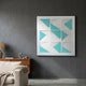 Prismatics Turquoise Geometric Cardboard Wall Art by Giant Sculptures displayed on a dark grey wall above a wooden sideboard in a modern living room.