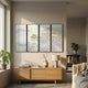 Velantra Harmonious Multi-Panel Silk Art by Giant Sculptures displayed above a wooden sideboard in a sunlit living room with plants and bookshelf.
