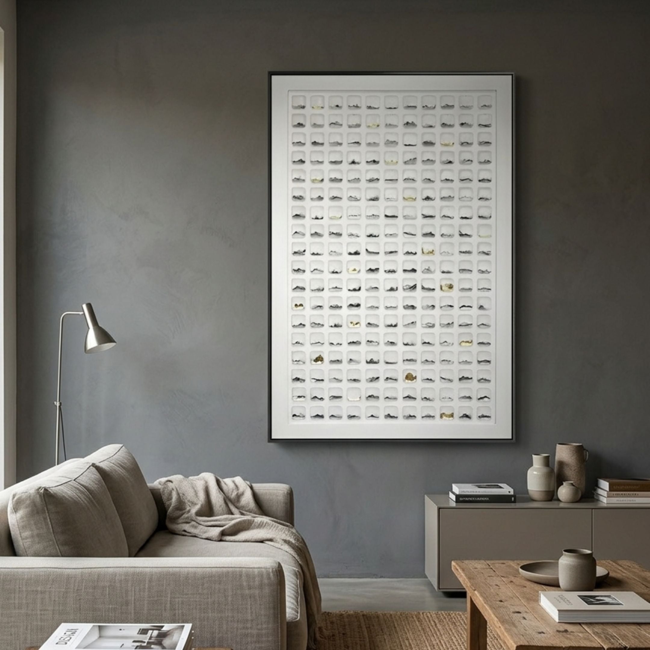 Luneve Gold Leaf 3D Ceramic Wall Art by Giant Sculptures displayed on a grey wall above a beige sofa and console in a modern living room.