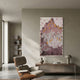 Artevo 3D Ceramic Wall Art with Plum & Amber Tones displayed on a neutral wall above a wooden sideboard, beside a leather lounge chair in a modern living room.