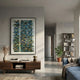 Timewave Multicoloured Abstract Lines Enamel Wall Art in a black frame above a walnut console in a modern living room with a blue sofa and bookshelf.
