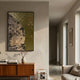 Astrid Earthy Bloom Gold Textured Abstract Wall Art with marbled grey-beige and gilded green-gold halves, mounted above a teak credenza in a sunlit hallway.