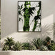 The Verdaryn Bamboo Trunk Green Moss Textured 3D Wall Art by Giant Sculptures hangs on a white wall above assorted succulents and cacti, bringing striking Nordic interior decor to this sunlit indoor space.