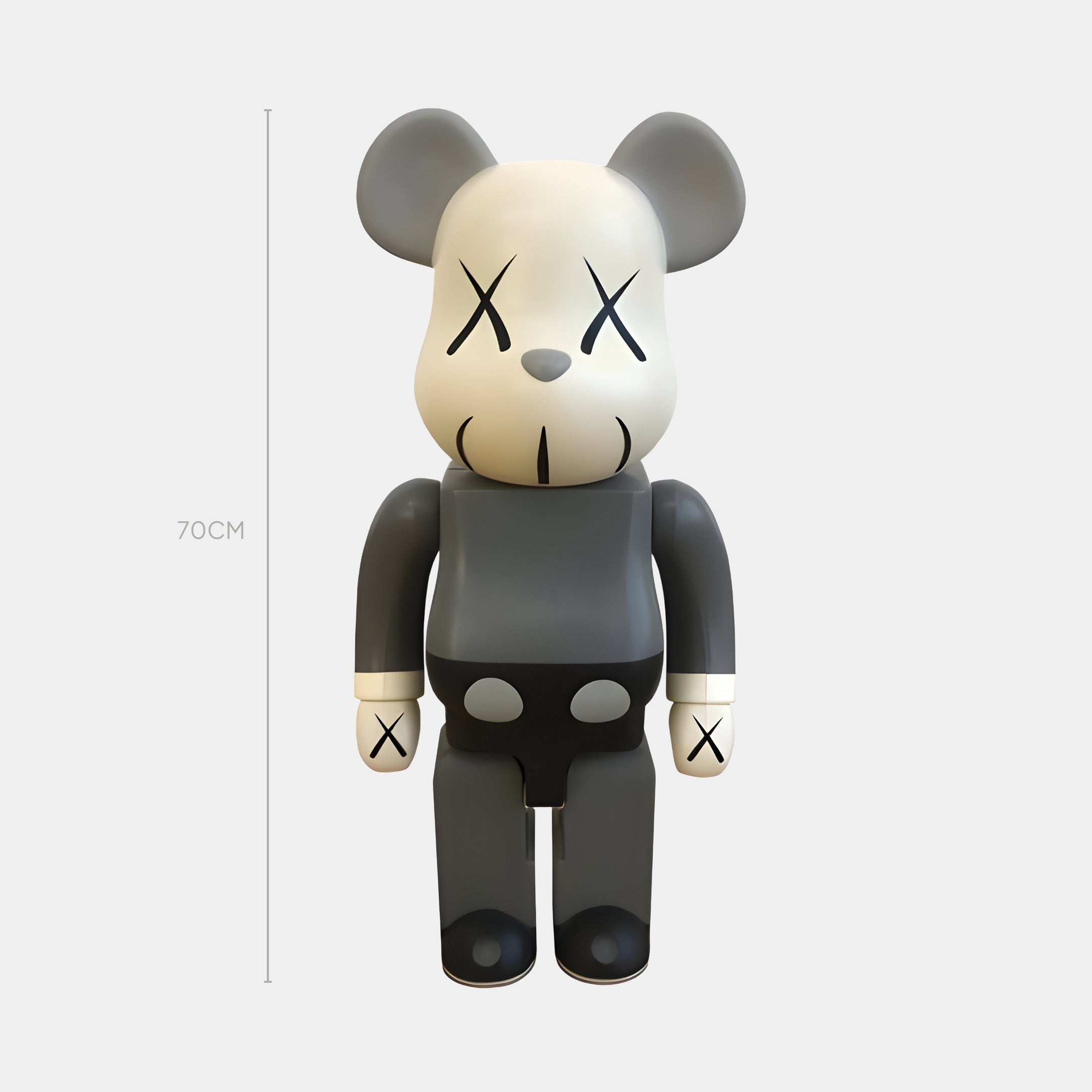 The X-Mark Studio Grey Bear Sculpture by Giant Sculptures stands 70cm tall with X’s for eyes and wrists, a stitched mouth, and a neutral face—an ideal piece of monochrome minimalism for contemporary interiors.