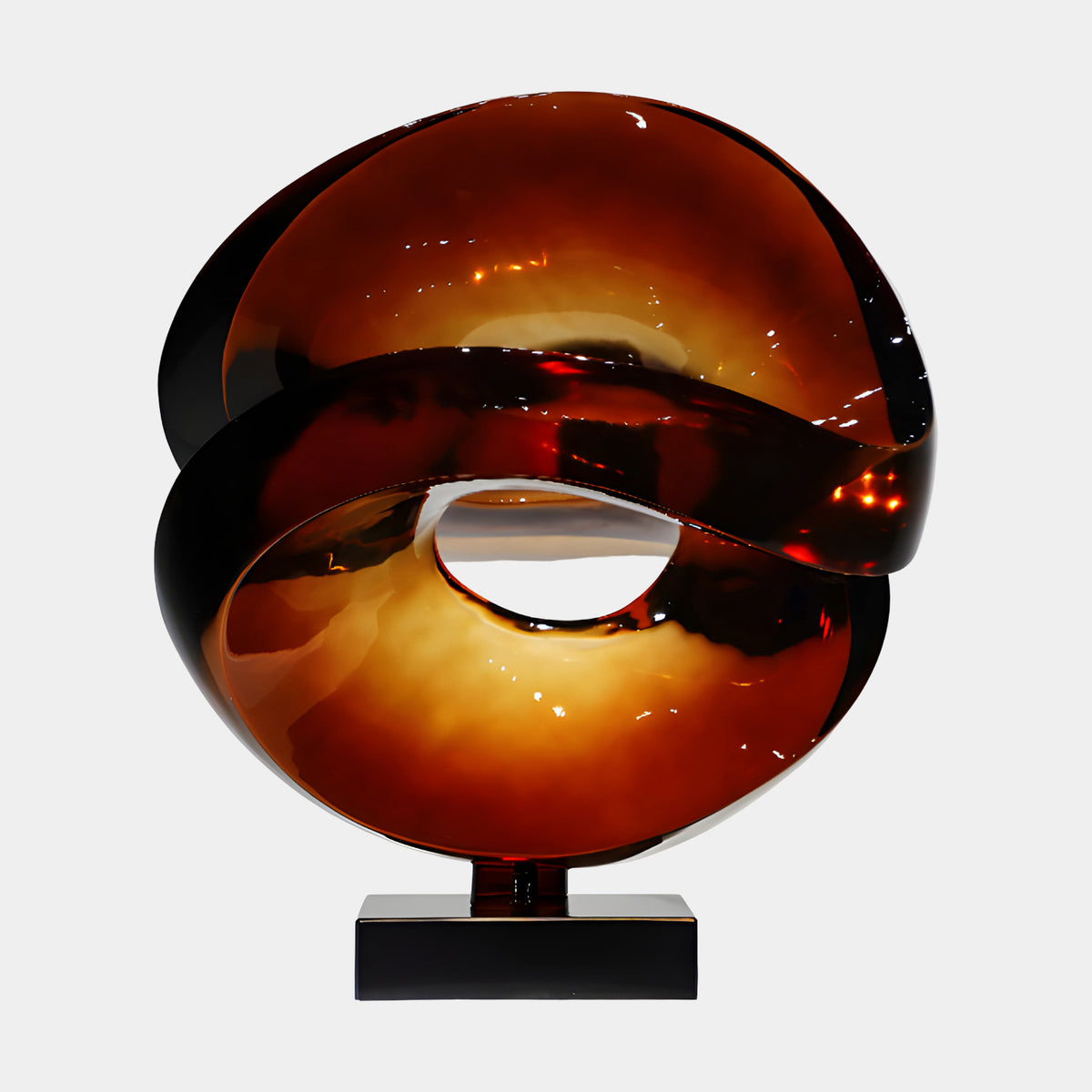 Red Amber Cut Sphere on Marble Resin Sculpture, 66cm, glossy swirled amber-brown resin form on a black marble base, set against a plain white background.