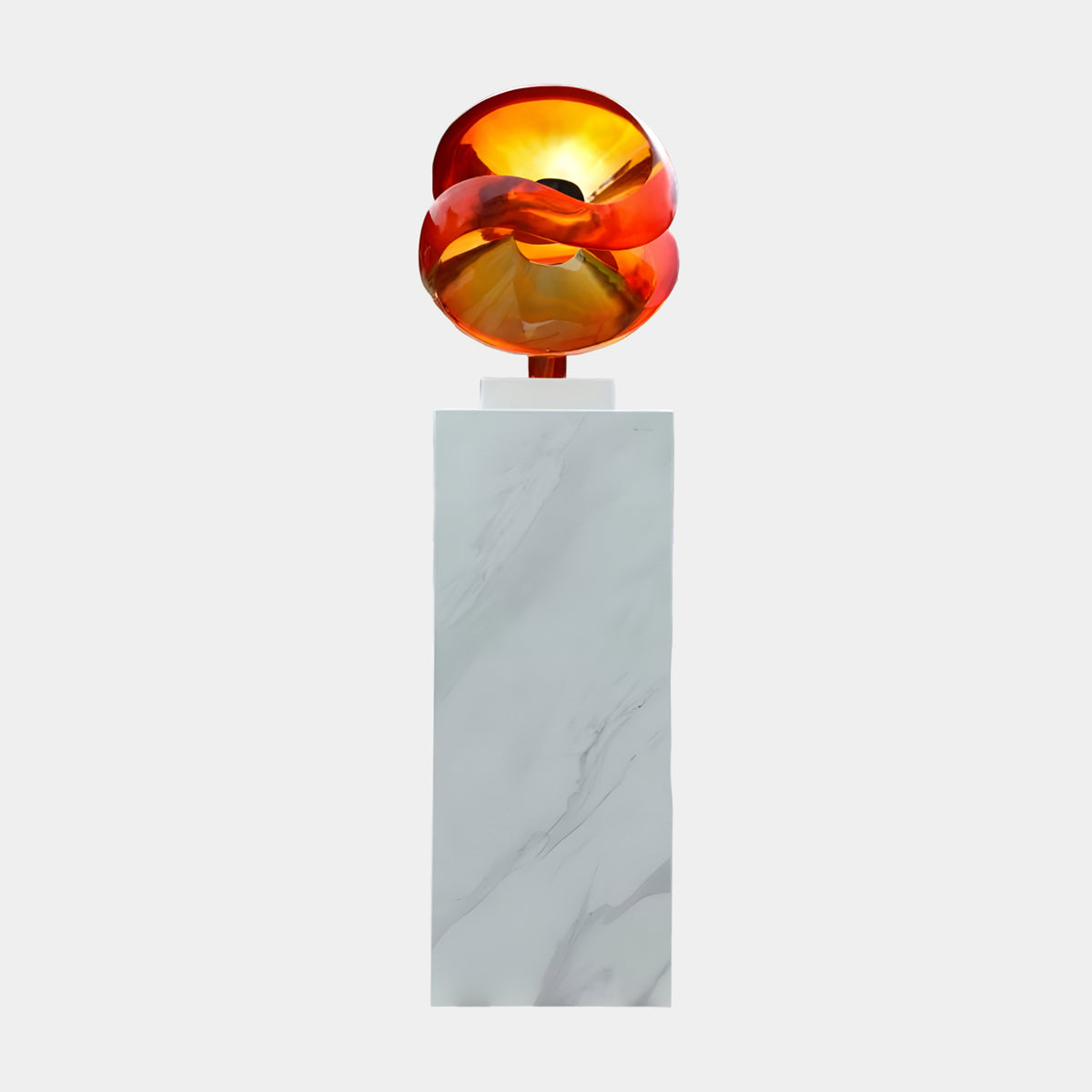 Amber Twin Loop Sphere Resin Sculpture, 159cm, with looped amber-to-gold bands on a tall white marble plinth against a plain light background.