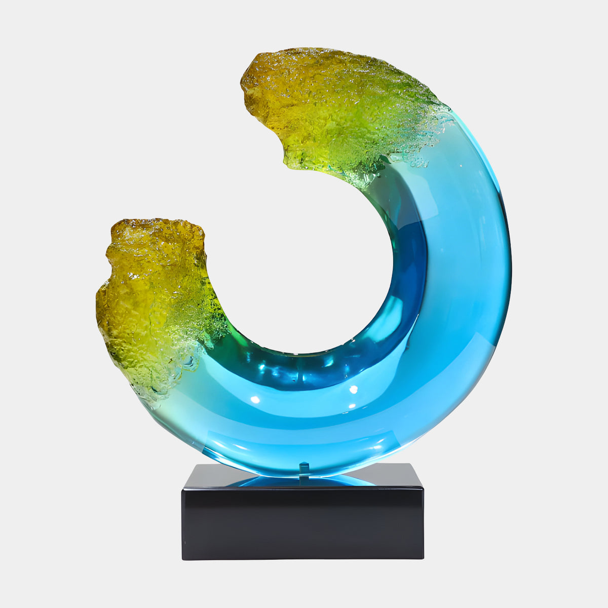 Aqua Blue Broken Ring Resin Sculpture, 42cm, a translucent blue ring with frosted yellow-green tips on a black marble base, set against a plain white background.