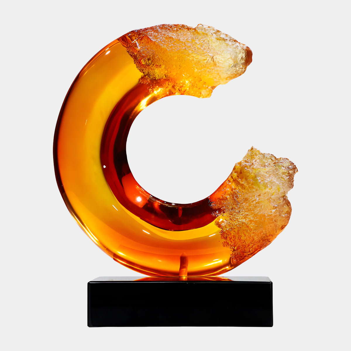 Orange Amber Broken Ring Resin Sculpture, 60cm, with frosted crystallised amber ends on a black marble base, shown against a plain white background.