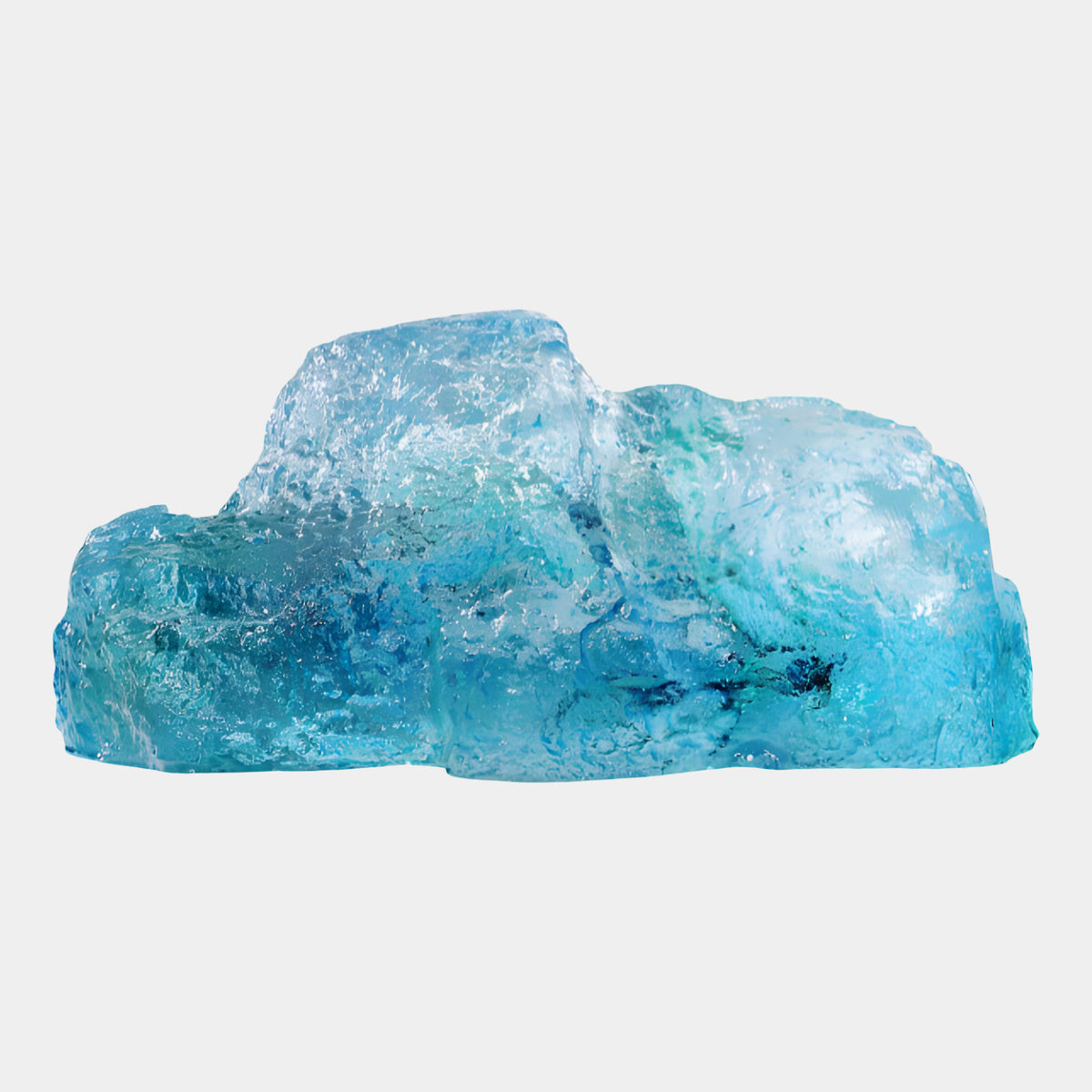 Blue Craggy Rock Resin Sculpture - 43cm with a terraced, granular surface shifting from pale aqua to deep blue, shown on a plain white background.