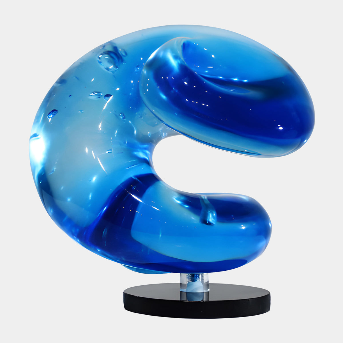 Blue Closing Curve Resin Sculpture - 22cm, a glossy blue open-circle form on a clear stem and black disc base, shown against a plain white background.