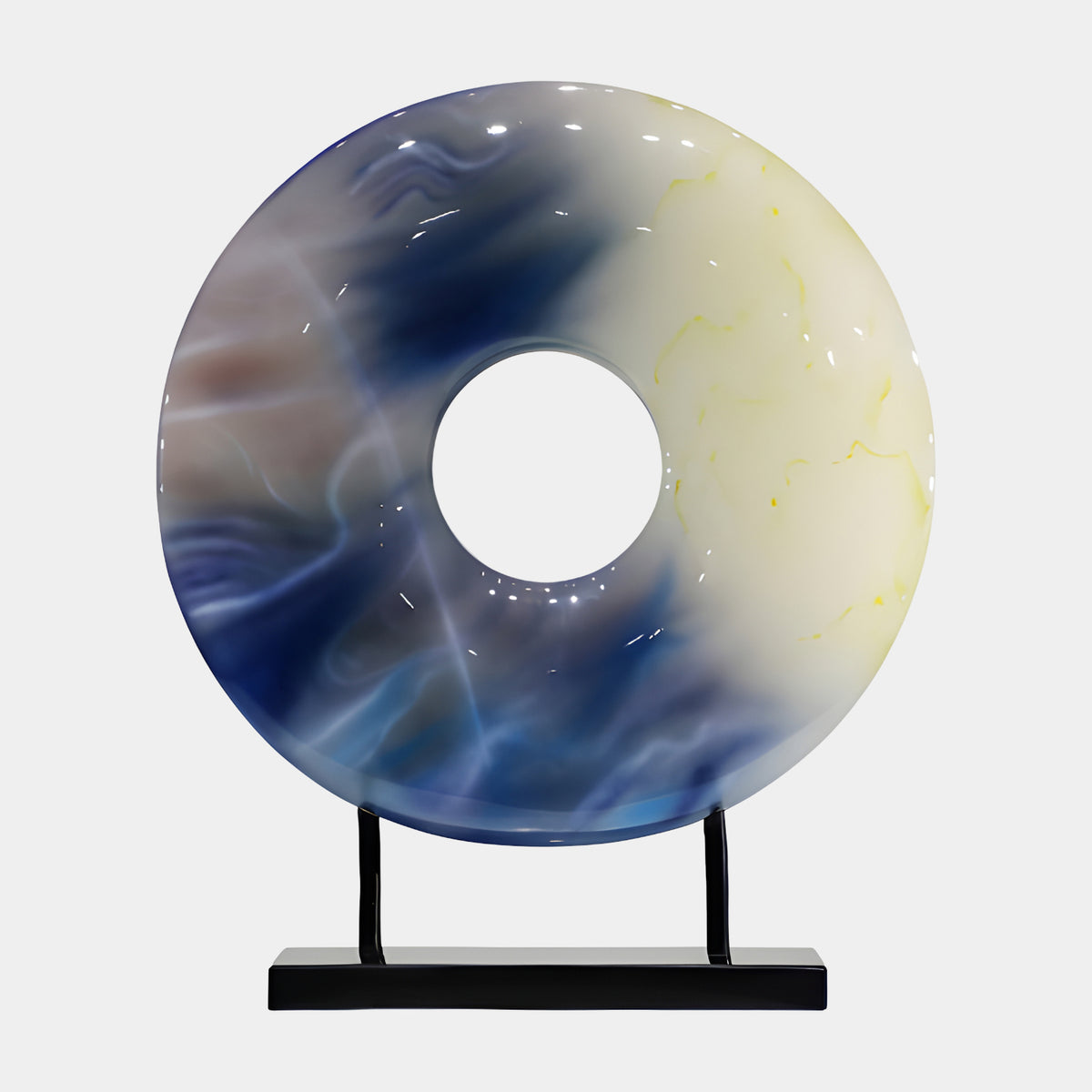 Blue & Cream Jade Effect Pierced Disc Resin Sculpture, 65cm, a polished ring form on a black two-post stand, set against a plain light grey background.