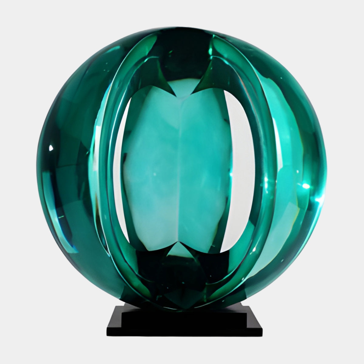 Teal Segmented Cut Sphere Resin Sculpture, 63cm, with a lens-shaped cutout revealing an inner form, on a black marble base, plain white background.