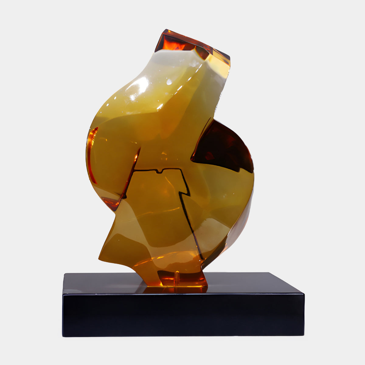 Amber Stepped Flat Cut Mass Resin Sculpture - 52cm, faceted amber form shifting from golden to deep amber tones, set on a black marble base, plain light background.