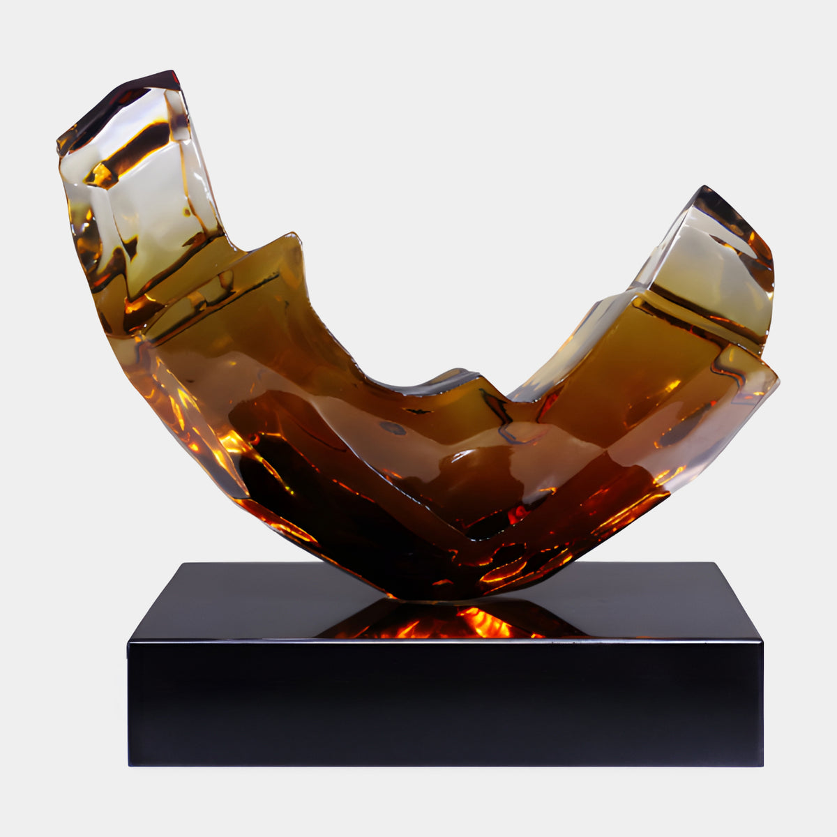 Amber Flat Cut Open Trough Resin Sculpture, 43cm, curved faceted form on a black marble base, set against a plain white background.