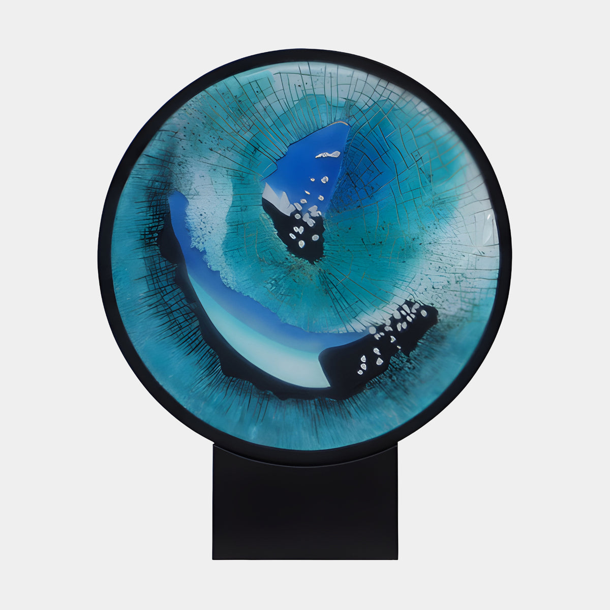 Turquoise Radiating Field Framed Disc Resin Sculpture, 55cm, with dark blue and pale forms inside a black rim, on a black marble base, plain white background.